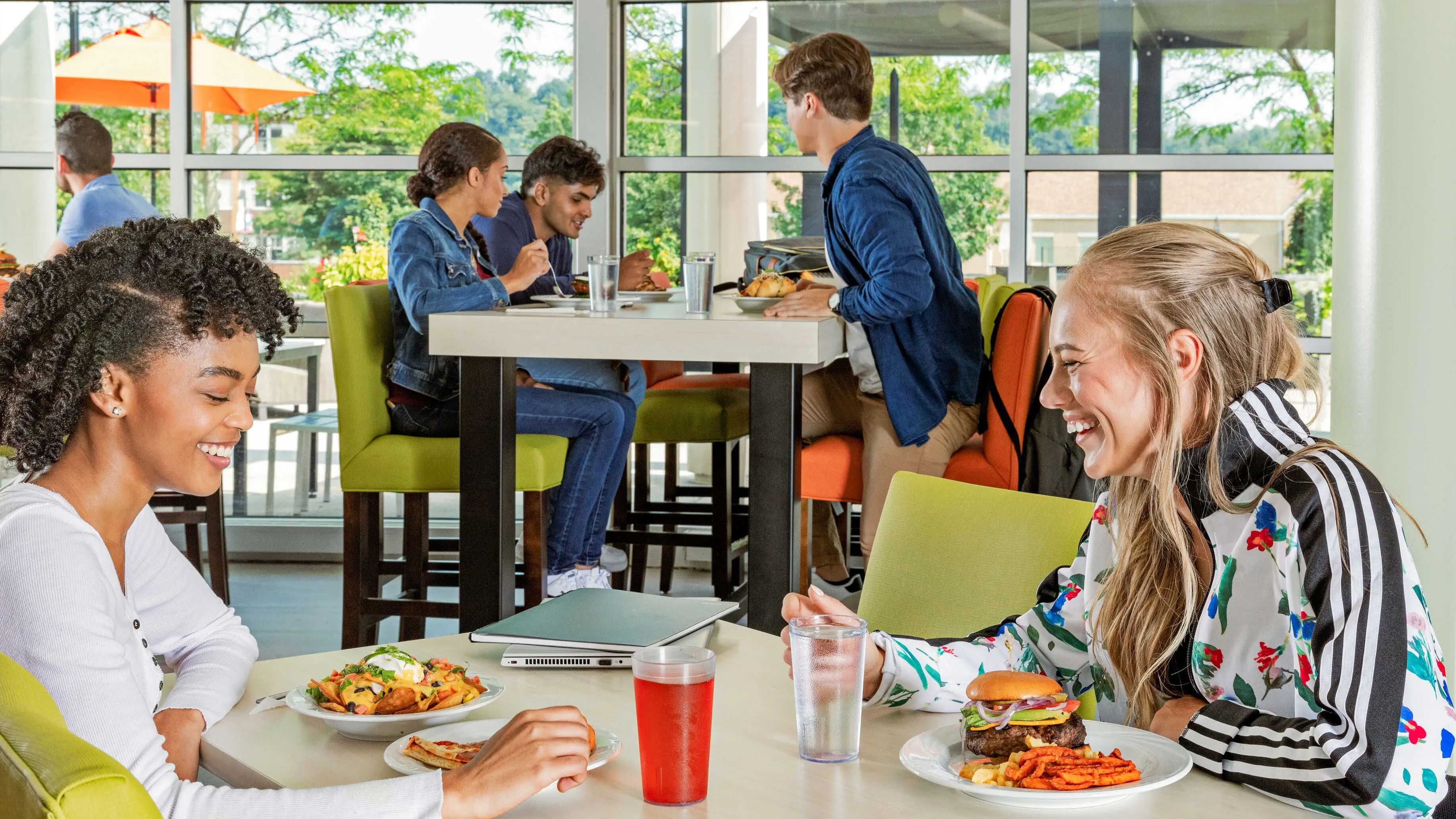 Students enjoying a meal in a dining room